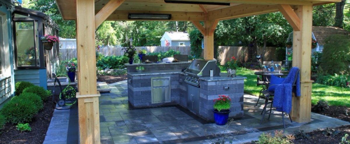 Enjoy alfresco dining with a customized outdoor kitchen featured
